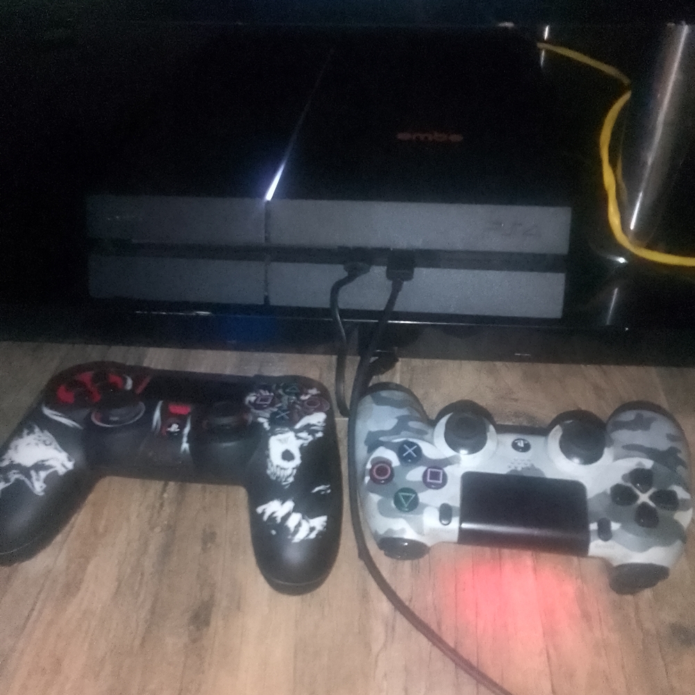 Sony PlayStation 4 Console with DualShock Controllers - Black and Gray